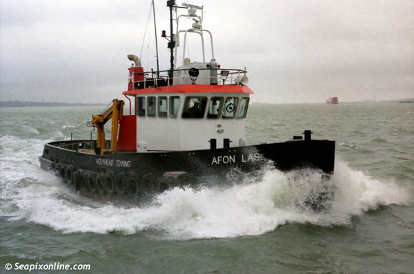 AFON LASS (1982/182grt/IMO 7625433/HOLYHEAD TOWING, NORTH WALES. Since renamed LOKE R and operates in Denmark) see here at speed in windy weather, Southampton, England. February 1998. Photo by Â© SeapixOnline.com